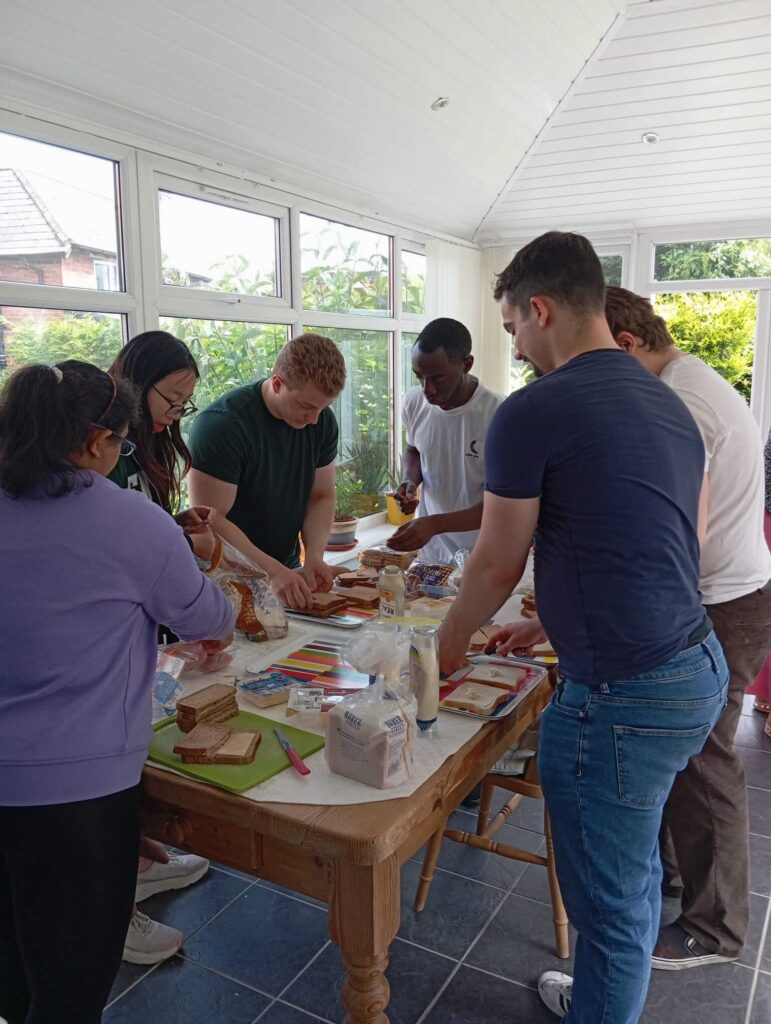 group-at-table-prep-sandwiches
